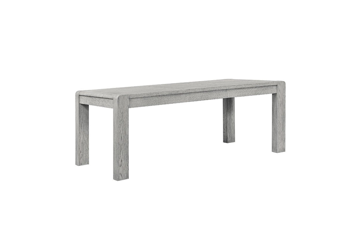 A modern rectangular bench with a weathered light gray wood-grain finish, shown from a three-quarters angle on a solid white background.