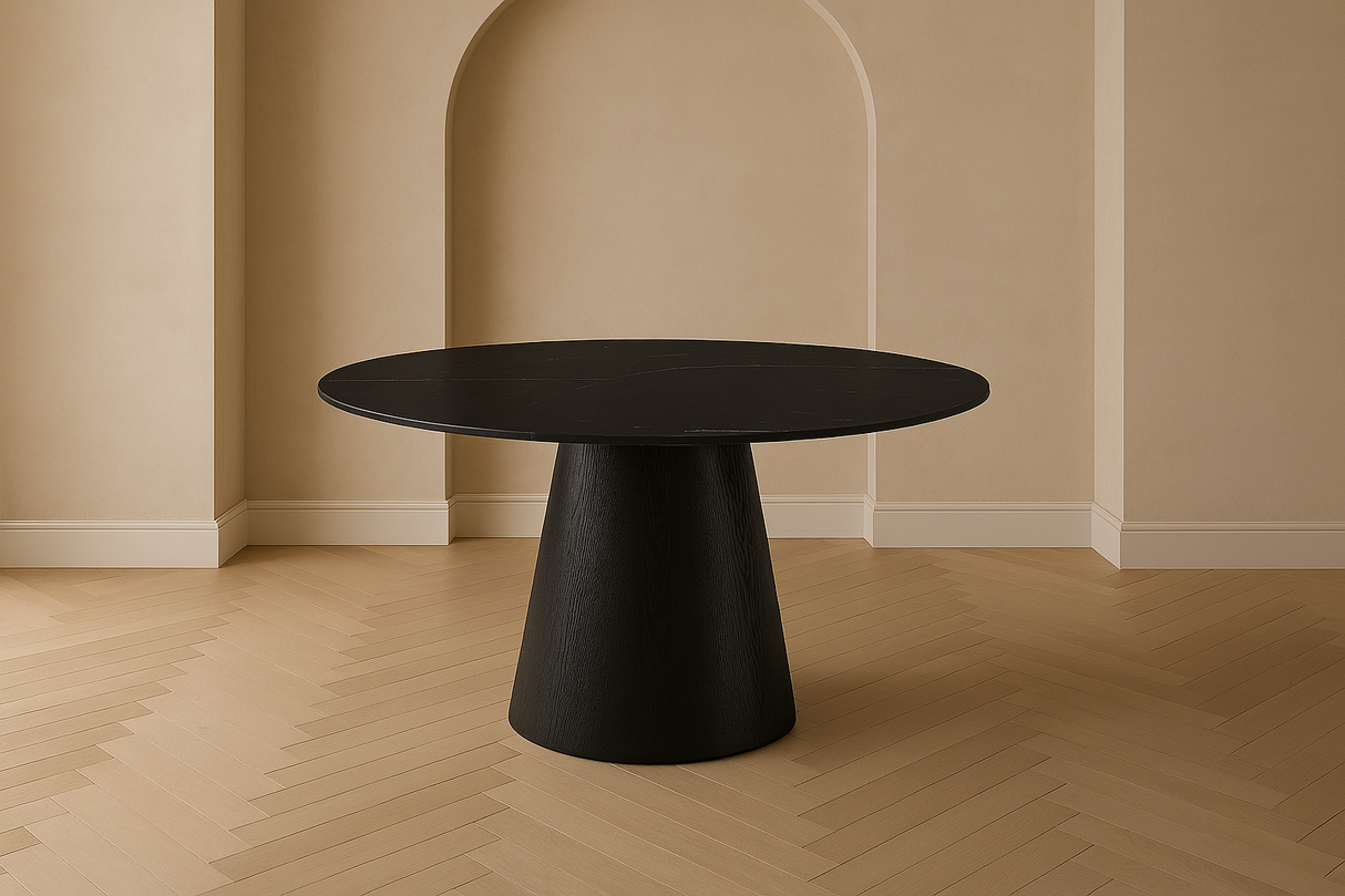 Black round table in a room with beige walls and wooden floor at the furniture store ni