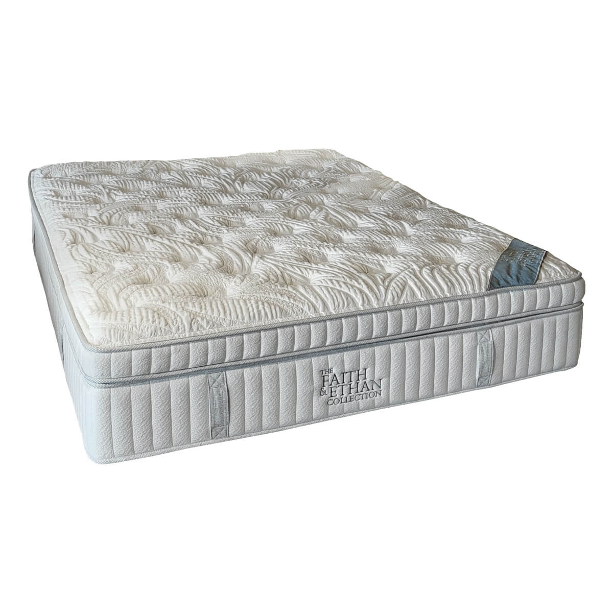 Malaga mattress corner close-up showing the tack and jump quilted top and Faith & Ethan label