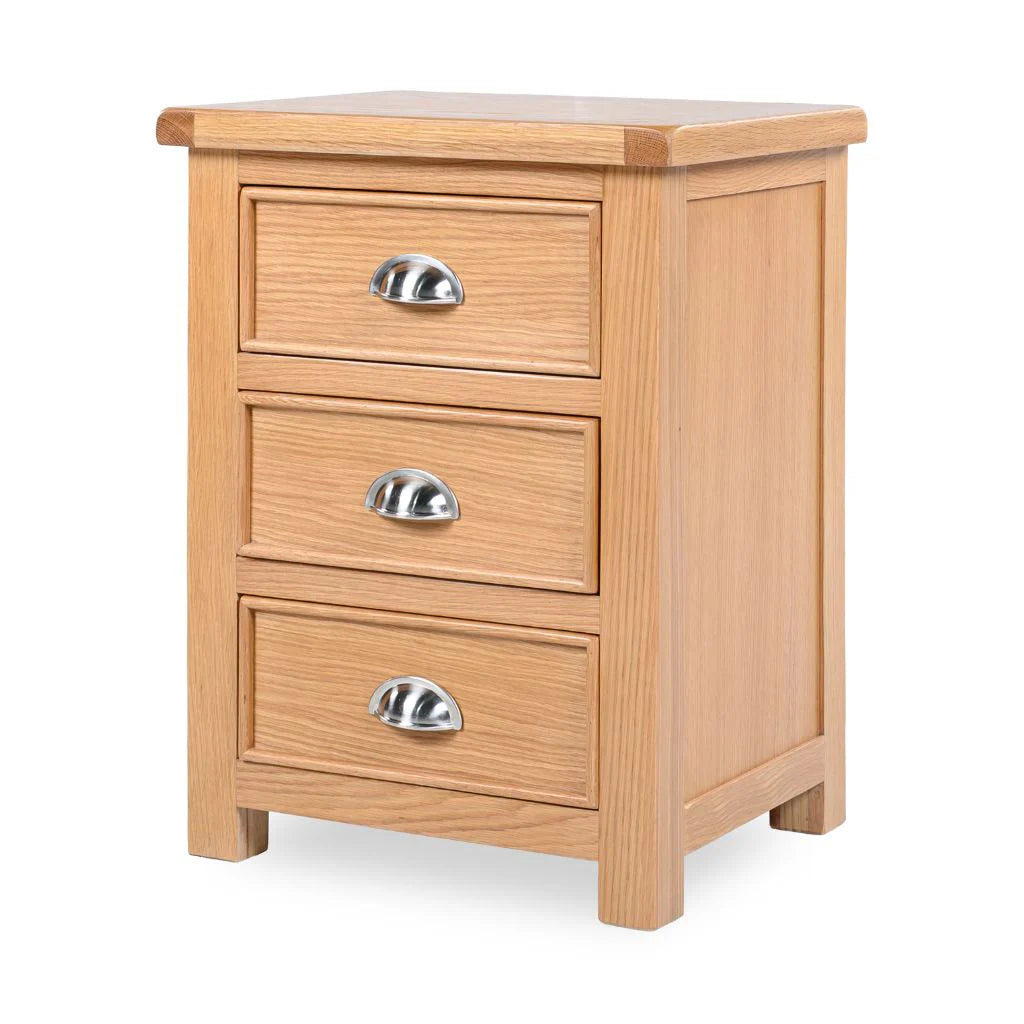 Wooden nightstand with three drawers and silver handles on a white background