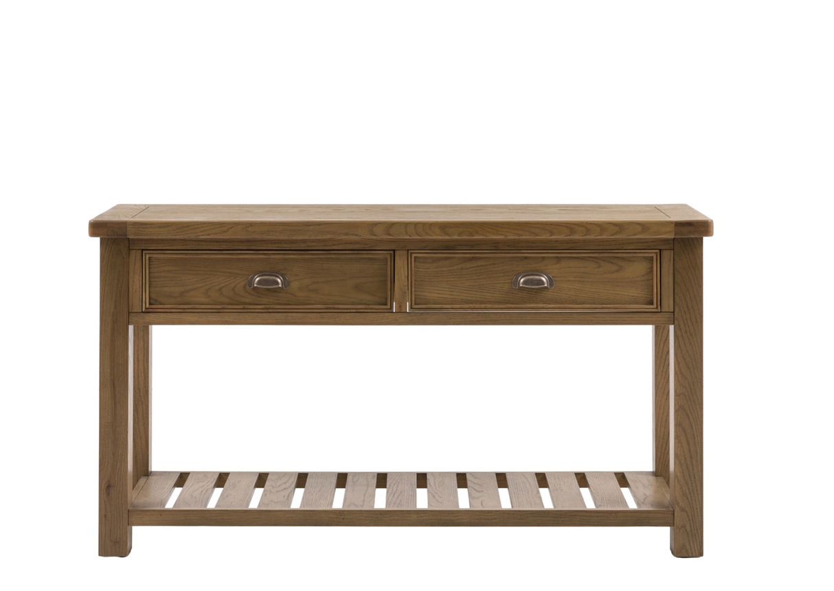 Hardwick large oak console table showcasing its warm natural wood grain finish, robust solid construction, two storage drawers, and a classic slatted lower shelf furniture store ni