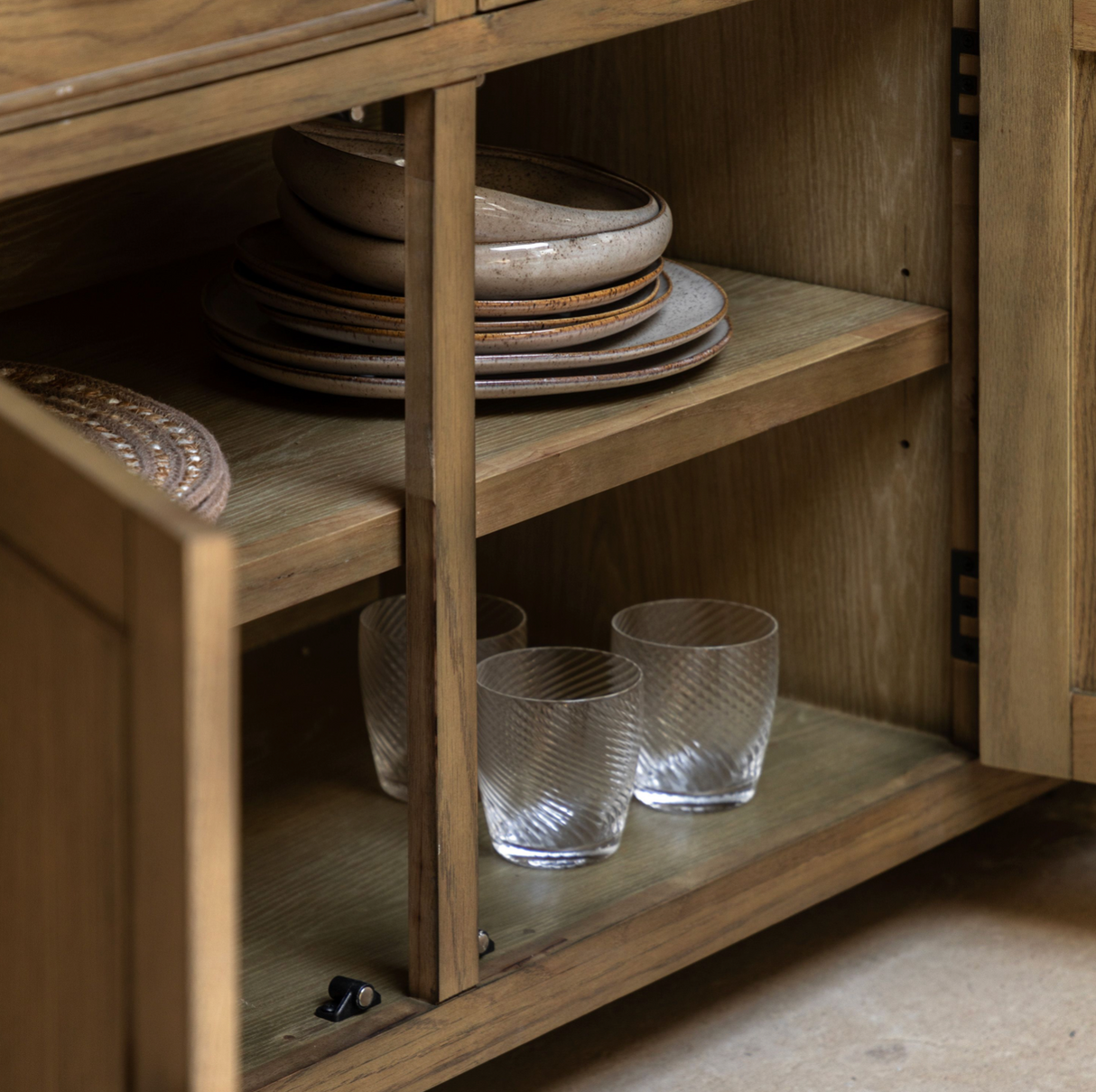 Hardwick large 3-door 3-drawer oak sideboard showcasing its expansive horizontal profile, warm natural wood grain finish, and classic metal handles at the furniture store ni