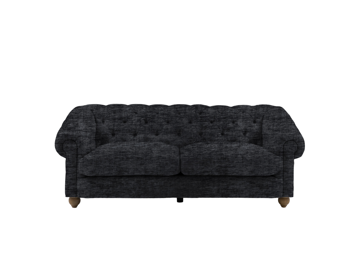 Modern 3-seater Chesterfield sofa showcasing its deep-buttoned back, elegant scrolled arms, and gracefully contoured silhouette sitting on solid ash legs Celine olive at the furniture store ni