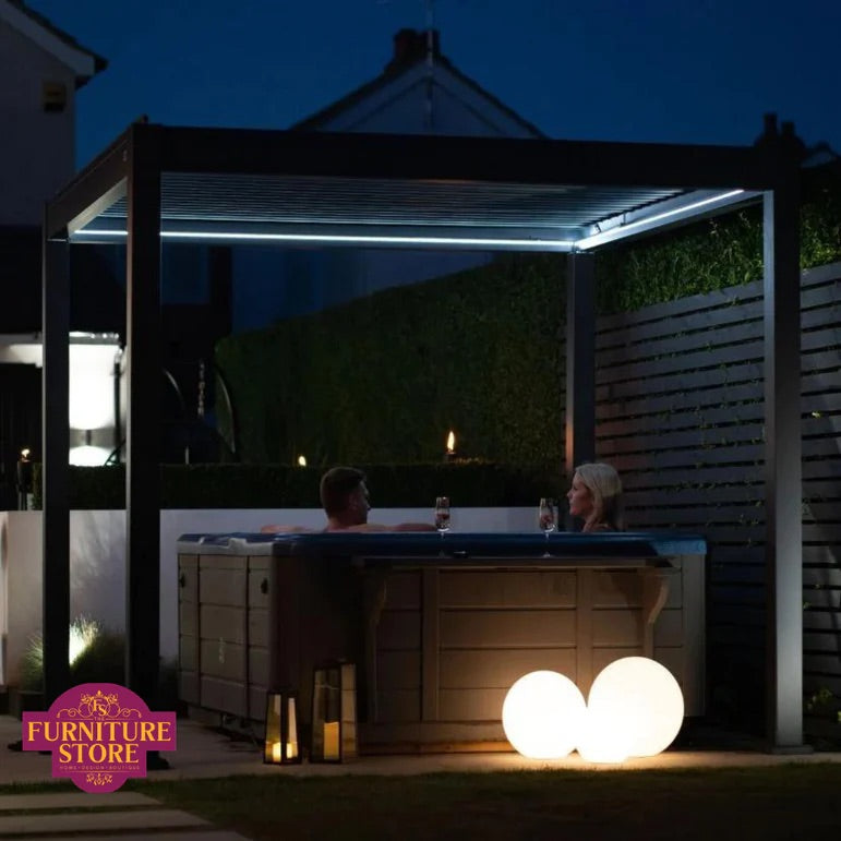 Titan Plus motorised pergola with adjustable louvred roof and integrated LED lighting in a luxury outdoor garden setting. furniture store ni