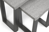 Close-up of a modern table with a light gray wood grain top and dark charcoal metal legs, shown on a white background.