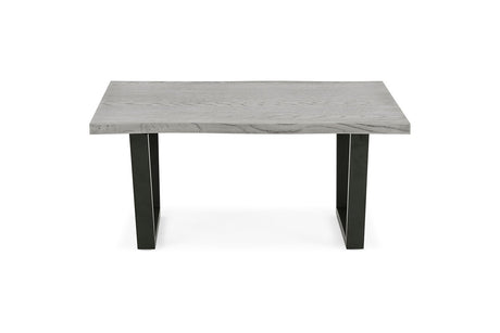 A modern rectangular table with a light gray stone or concrete-look top and two black angled legs, shown on a plain white background.