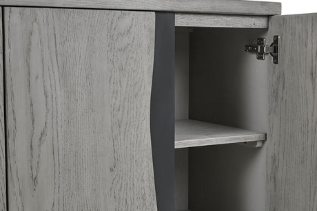 Close-up of a light gray wood cabinet with one door open, showing the interior shelf and dark gray side panel.