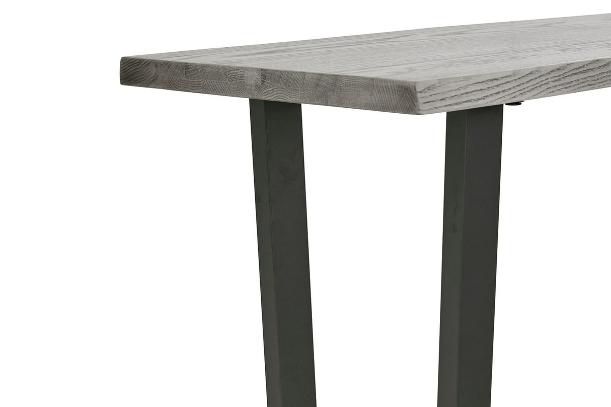 Close-up of a rectangular table showing a gray wood grain tabletop and dark charcoal metal legs on a white background.