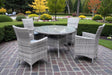 Madrid 4-seater garden dining set featuring grey rattan chairs with cushions and a central glass-topped table on a patio at furniture store ni