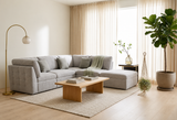 Alexandra modular corner sofa configured as a spacious L-shaped sectional in plush grey fabric with coordinating scatter cushions at the furniture store ni