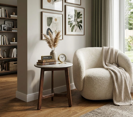 Barcelona contemporary side table with a square white marble top and a sleek mid-century modern architectural frame, styled next to a luxury chair at the furniture store ni