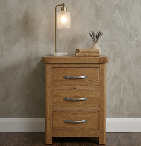 manhattan nightstand with three drawers, lamp, and books against a textured wall furniture store ni