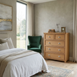 Newbury 5-drawer chest in light oak with distinctive drawer beading and polished silver cup handles at the furniture store ni