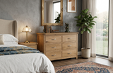 Manhattan solid oak sideboard featuring modern chrome handles and a rich, natural wax finish at the furniture store ni