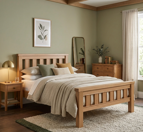 Newbury light oak bedframe in a bright, modern bedroom, highlighting the natural oak finish and clean lines at the furniture store ni