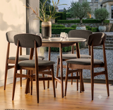 Barcelona contemporary round dining table with a premium white marble top and a sleek architectural base, styled as a 4-seater bistro set at the furniture store ni