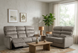 Savoy Suite in soft-touch taupe fabric, displayed as a 3-seater and armchair set in a minimalist living room at the furniture store ni