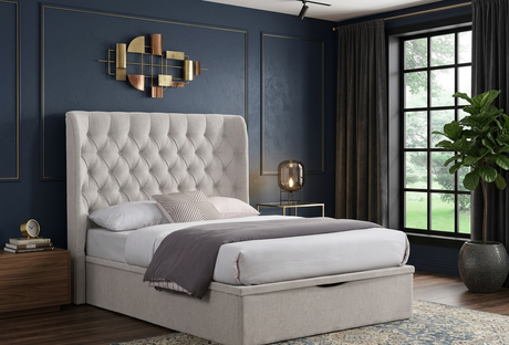 Clara gas lift storage bed in chic Beige fabric, featuring a beautifully tufted buttoned headboard in a bright, minimalist bedroom setting at the furniture store ni
