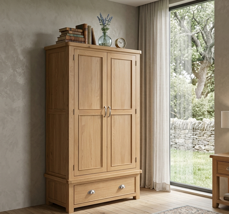 Newbury 2-door wardrobe in light oak with distinctive beading detail and polished silver cup handles at the furniture store ni