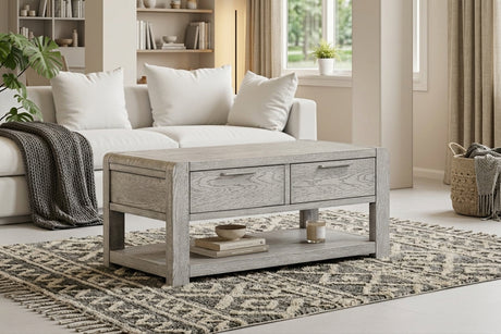 Amsterdam grey washed oak 2-drawer coffee table showcasing its 115cm wide rectangular surface, subtle grey-washed oak grain finish, and two front storage drawers at the furniture store ni
