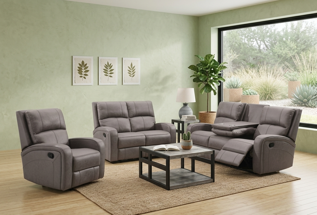 Gray silverton reclining sofa set in a living room with a coffee table and decor at furniture store ni