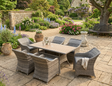 Valencia garden dining set with stylish wicker chairs, polyester cushions, and a sleek Polywood-topped rectangular table at the furniture store ni