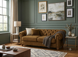 Modern 3-seater Chesterfield sofa showcasing its deep-buttoned back, in Celine harvest, elegant scrolled arms, and gracefully contoured silhouette sitting on solid ash legs Celine olive at the furniture store ni 