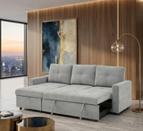 Gray sectional sofa in a modern living room with a cityscape view at furniture store ni