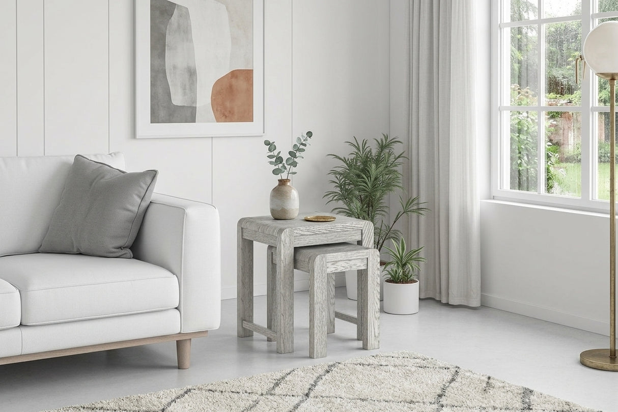 Amsterdam grey washed oak nest of tables arranged together, highlighting their subtle grey-washed wood grain finish and clean nesting design at the furniture store ni