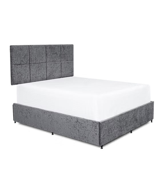 Gray upholstered bed with white mattress on a transparent background at the furniture store ni