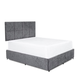Gray upholstered bed with white mattress on a transparent background at the furniture store ni