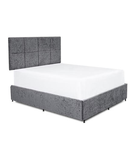 Gray upholstered bed with white mattress on a transparent background at the furniture store ni
