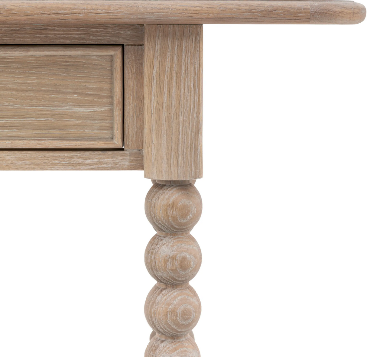 Wooden table with a drawer and decorative leg on a white background at the furniture store ni