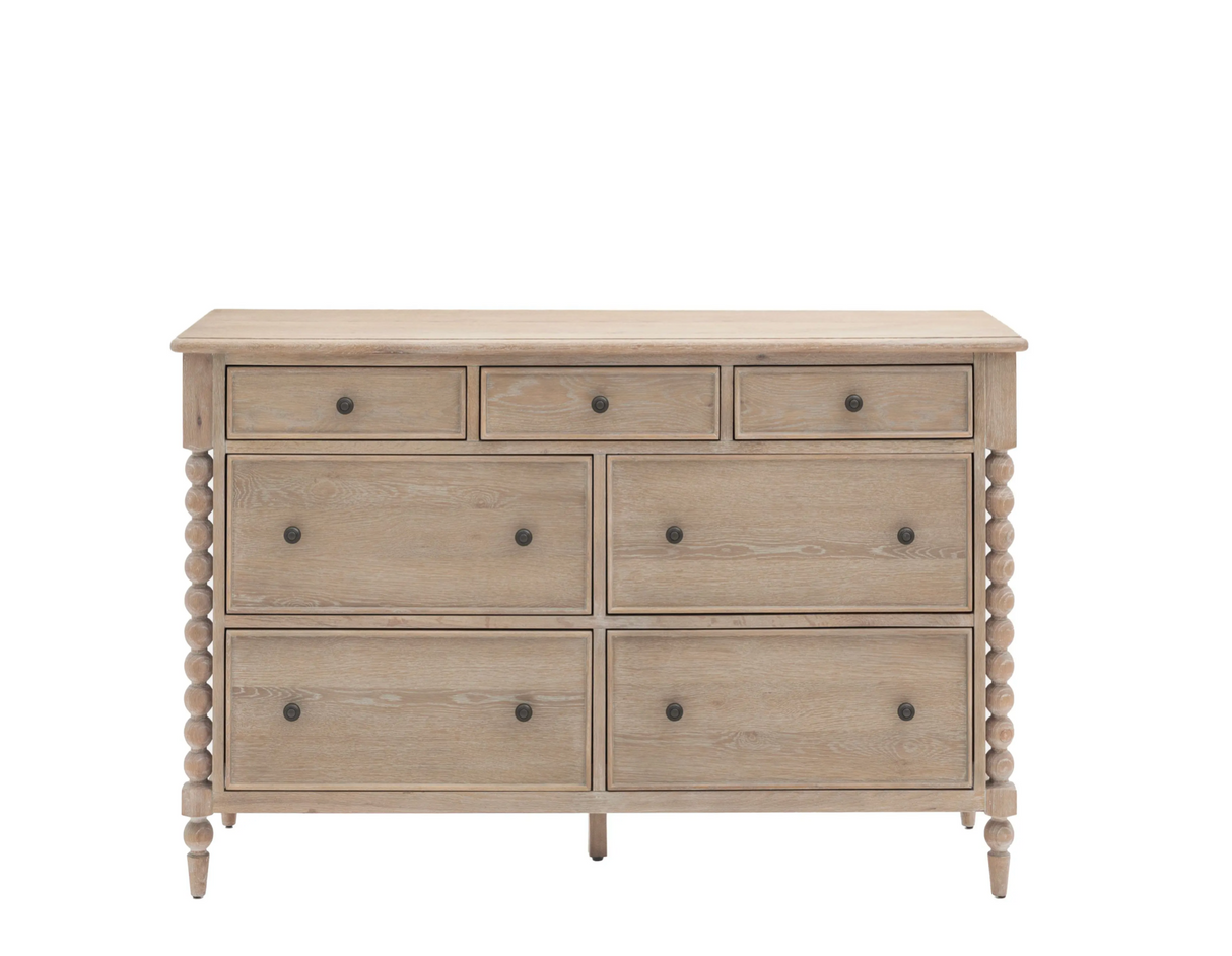 Wooden dresser with multiple drawers on a white background at the furniture store ni