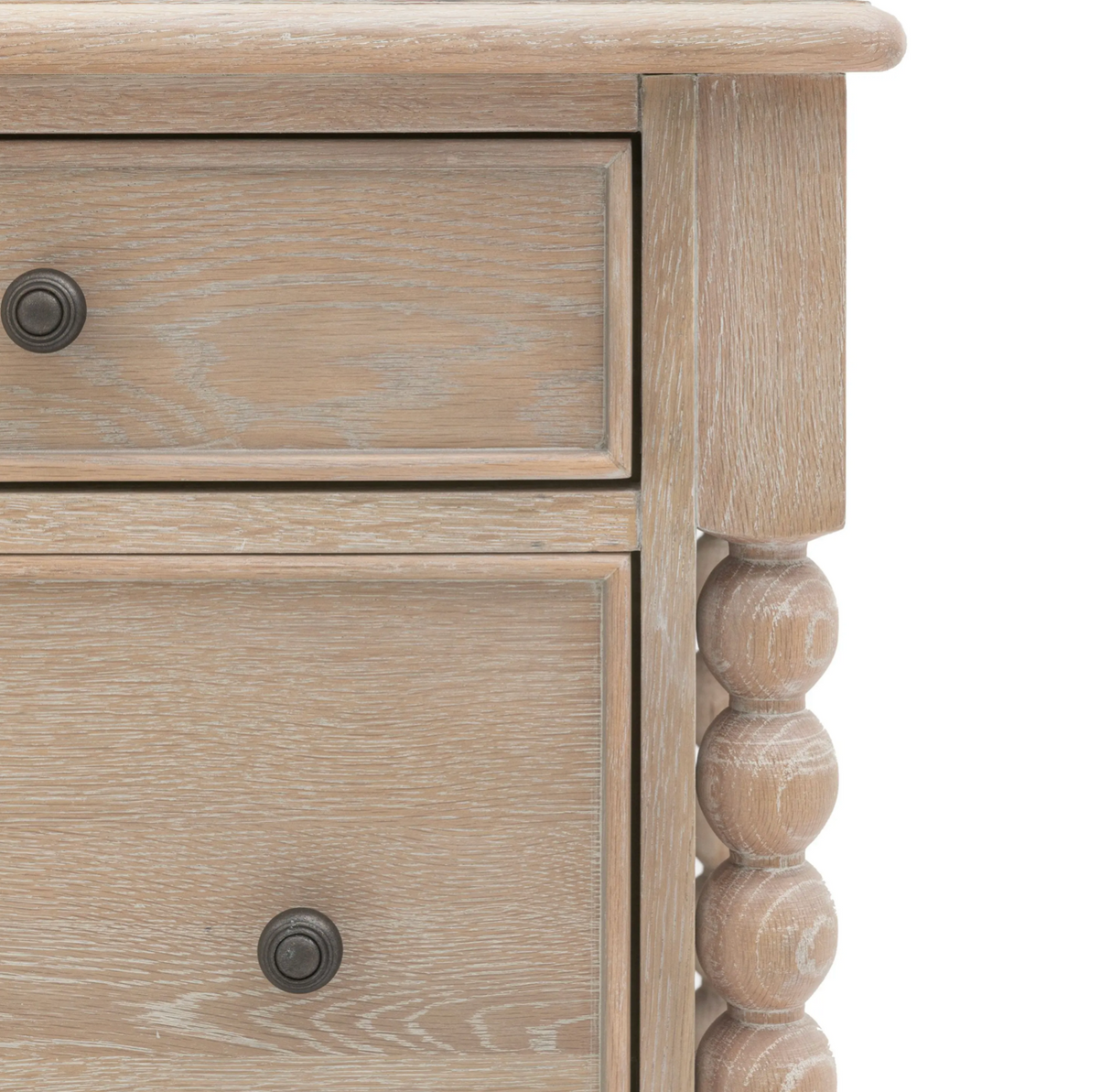 Wooden drawer with two knobs on a light wood finish at the furniture store ni