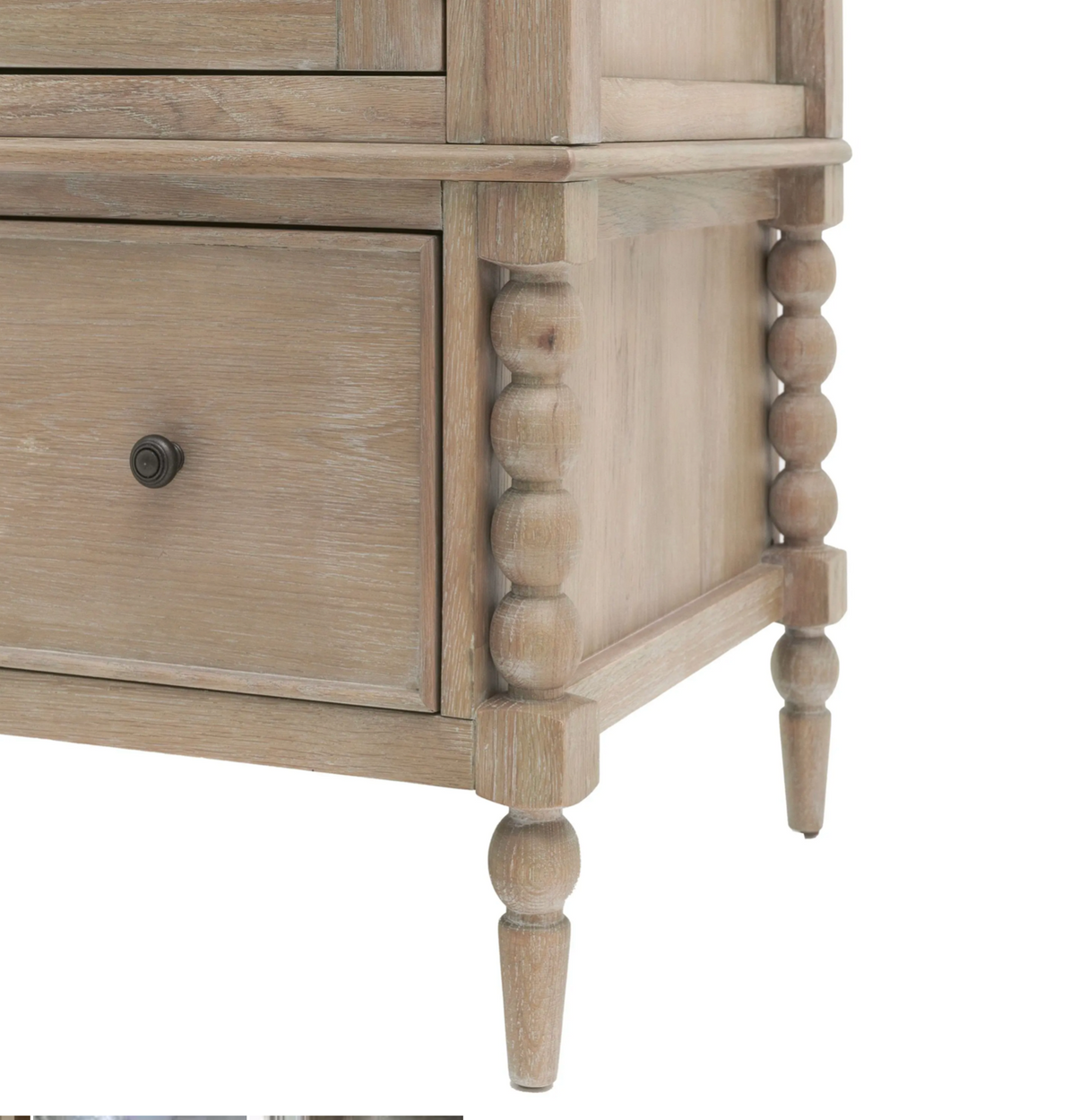 Wooden dresser with spindle legs on a white background at the furniture store ni