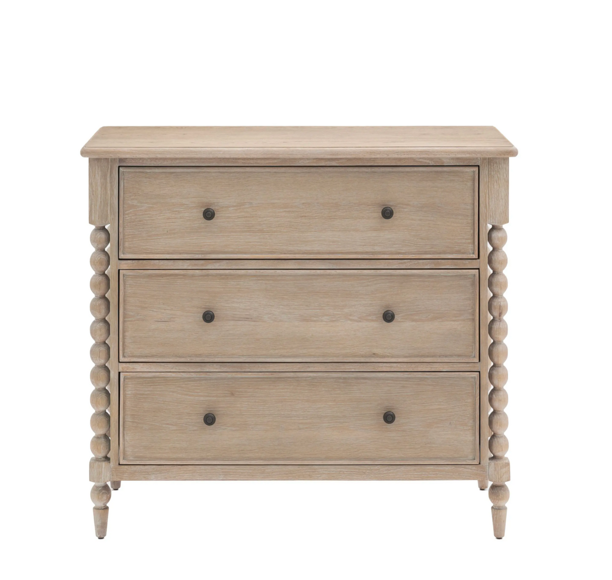 Artisan 3-drawer medium chest showcasing its exquisite hand-crafted bobbin turned frame details, premium oak wood grain, and a subtle lime wash finish at the furniture store ni