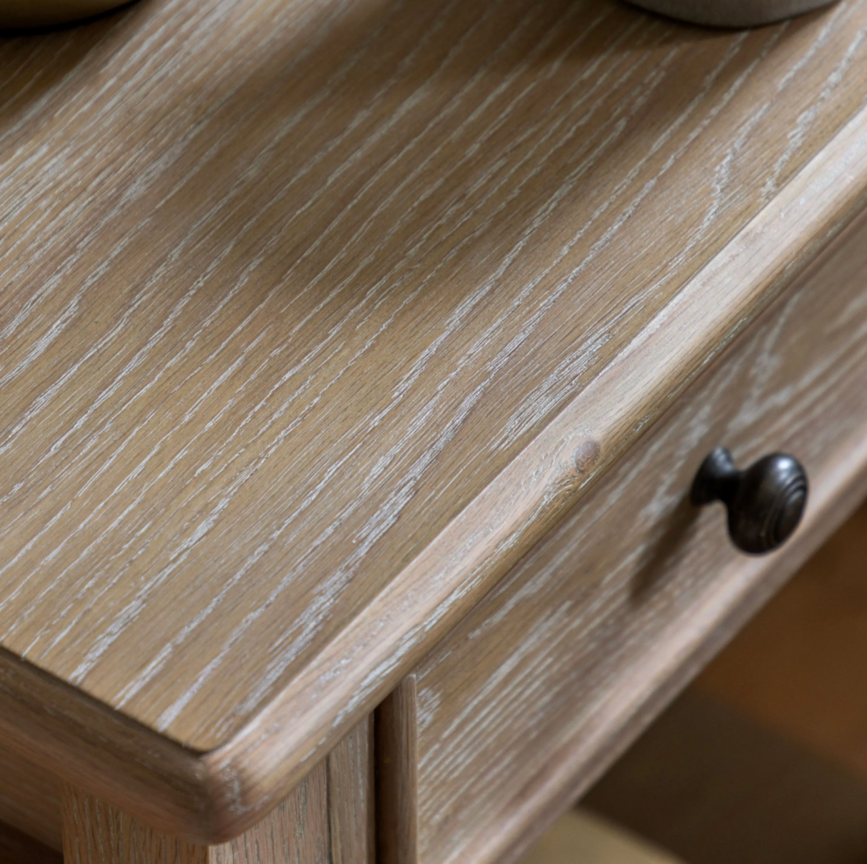 Close-up of a wooden drawer with a dark handle at the furniture store ni
