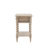 Wooden side table with spindle legs on a white background at the furniture store ni
