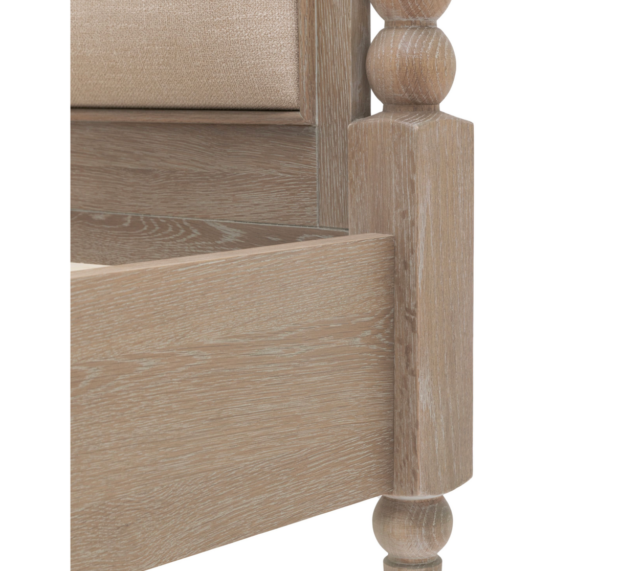 Artisan luxury oak bed frame showing the striking hand-crafted bobbin detailing across the high headboard at the furniture store ni