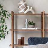 Cannes wide 4-tier open display unit made from warm acacia wood, showcasing its retro rounded uprights and slim, elegant shelves close up at furniture store ni
