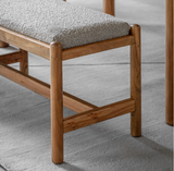 Cannes 1.6-meter wooden dining bench crafted from warm, richly grained acacia wood, showing its retro-modern silhouette and clean structural lines at furniture store ni