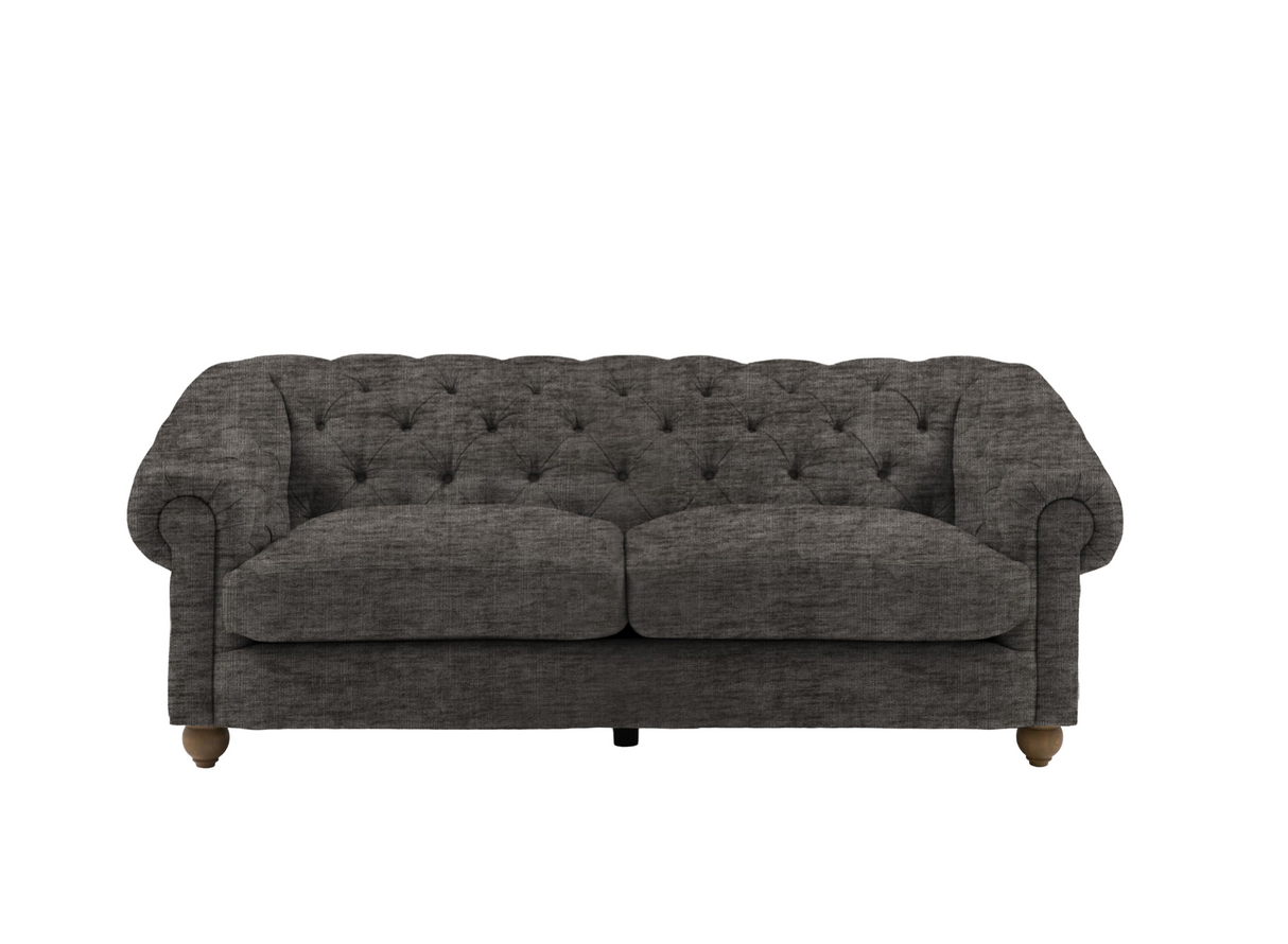 Modern 3-seater Chesterfield sofa showcasing its deep-buttoned back, in Celine flagstone, elegant scrolled arms, and gracefully contoured silhouette sitting on solid ash legs Celine olive at the furniture store ni 