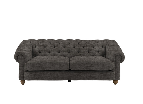 Modern 3-seater Chesterfield sofa showcasing its deep-buttoned back, in Celine flagstone, elegant scrolled arms, and gracefully contoured silhouette sitting on solid ash legs at the furniture store ni 
