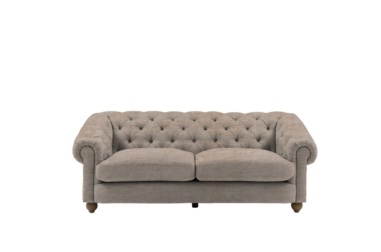Modern 3-seater Chesterfield sofa showcasing its deep-buttoned back, in Celine husk elegant scrolled arms, and gracefully contoured silhouette sitting on solid ash legs Celine olive at the furniture store ni 