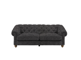 Modern 3-seater Chesterfield sofa showcasing its deep-buttoned back, in Mika ashen, elegant scrolled arms, and gracefully contoured silhouette sitting on solid ash legs at the furniture store ni 