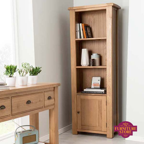 The Breeze tall bookcase comes in solid oak and comes with a door which has a round brass handle.