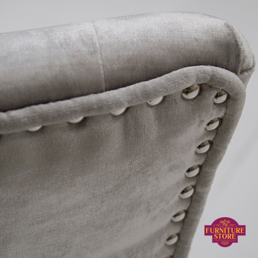 Studding detail on the back of the velvet grey belvedere chairs