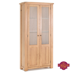 The Breeze solid oak display unit has two brass handles and two large doors.