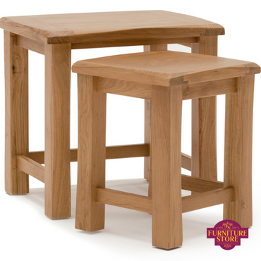 Breeze solid oak set of tables comes in set of 2 that fit neatly inside of each other.